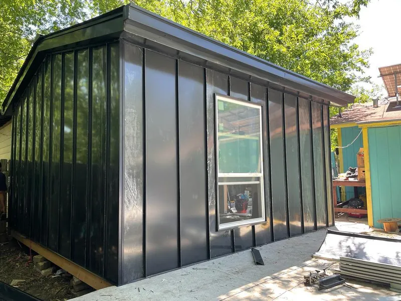 Black standing seam metal wall panels for Metal Roof Installation in Summerfield