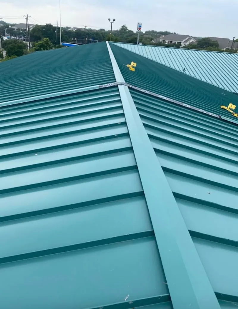 Green commercial metal roof ridge and valley for Metal Roof Repair in Summerfield